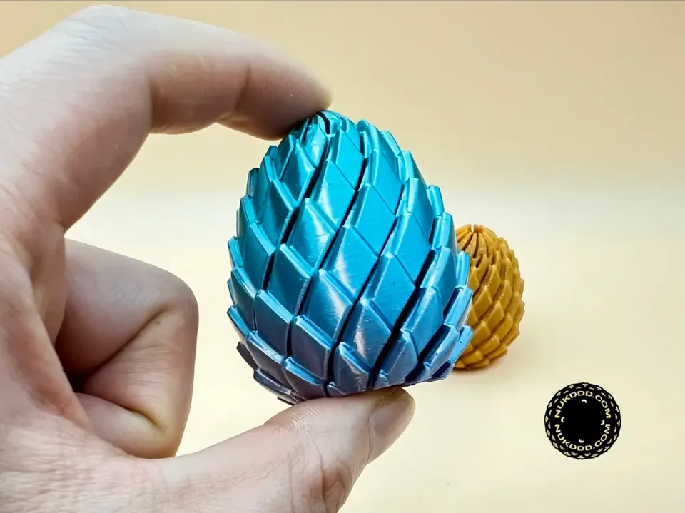 Mini huevo de dragón giratorio | Fidget antiestrés